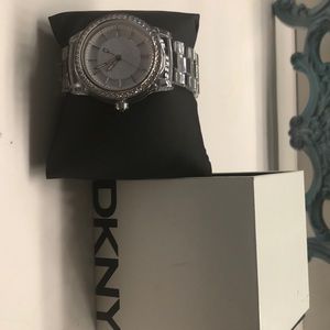 DKNY clear watch with rhinestone face.